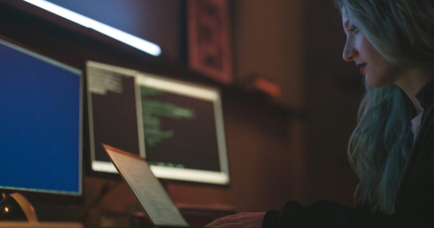 Free Side View of a Woman Using a Laptop Stock Photo