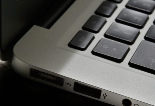 The-Zombie-SaaS-Audit_-Finding-the-3-Apps-Your-Former-Employees-Still-Access-scaled.jpg Free Detailed view of a silver laptop showing keyboard and multiple ports. Stock Photo