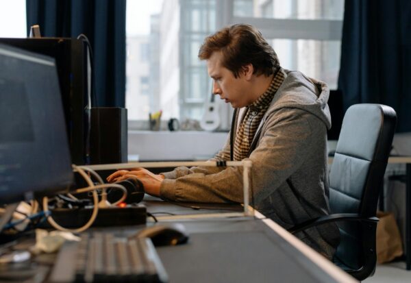 pexels-cottonbro-6803531-scaled.jpg Free A concentrated professional working at a computer in a modern office setting. Stock Photo