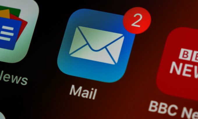 brett-jordan-LPZy4da9aRo-unsplash-scaled.jpg closeup of mail app icon on phone